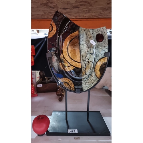 429 - Abstract glass art piece with bold circular and cracked textures, mounted on a metal stand. Contempo... 