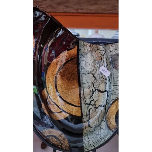 429 - Abstract glass art piece with bold circular and cracked textures, mounted on a metal stand. Contempo... 