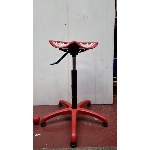 434 - Adjustable red cast iron tractor seat stool, marked 