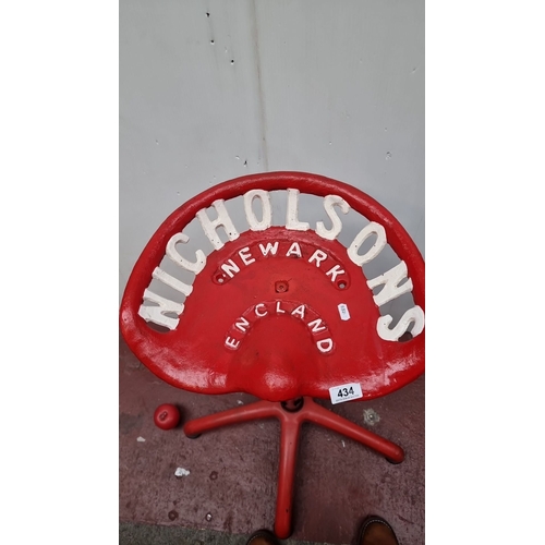 434 - Adjustable red cast iron tractor seat stool, marked 