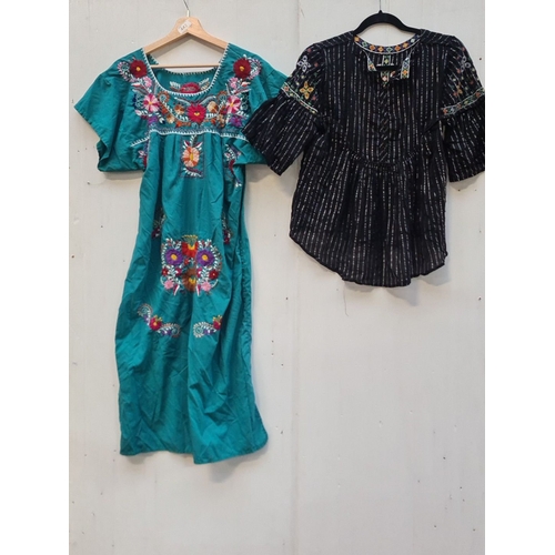 442 - Turquoise dress with vibrant floral designs, and a black blouse featuring colorful geometric pattern... 