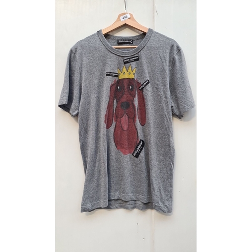 446 - Dolce & Gabbana grey T-shirt features a crowned dog print, logo patches, and graphic detail on the b... 