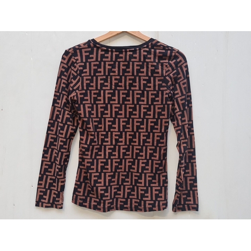 447 - A designer Fendi Roma long-sleeve top features the signature FF monogram pattern. Size M. RRP €699. ... 