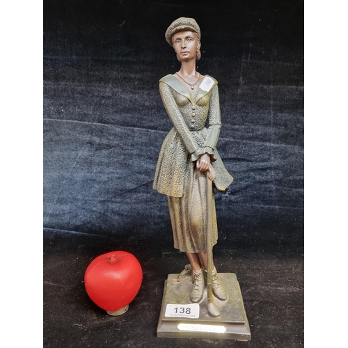 138 - A CROSA spelter figurine from the Juliana Collection depicting a female golfer.