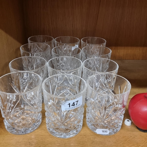 147 - 12 whiskey tumbler glasses featuring diamond cut pattern. All in good condition.