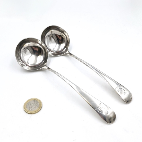 16 - A pair of Georgian sauce ladle's hallmarked London. Length - 16 cms. Total weight - 52 grams.