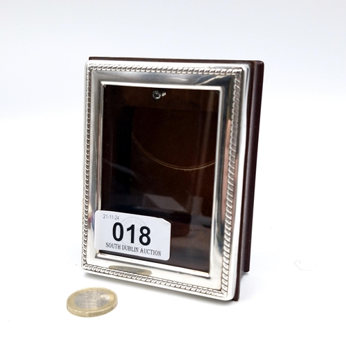 18 - A sterling silver photo frame ?  . Hallmarked Sheffield. Dimensions: 11 x 8 cms.