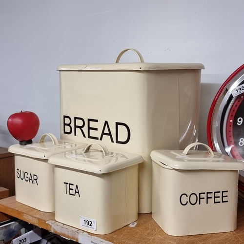 192 - Four kitchenware items comprising of tea, coffee and sugar canasters and a large bread bin. All in a... 