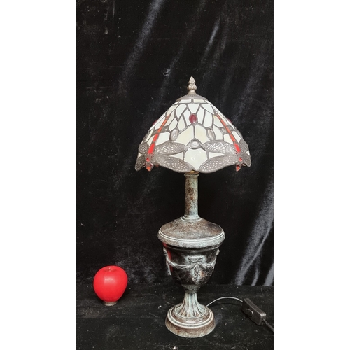 197 - A stylish unusual Tiffany style lamp with urn shaped base depicting lovely patina throughout. Requir... 