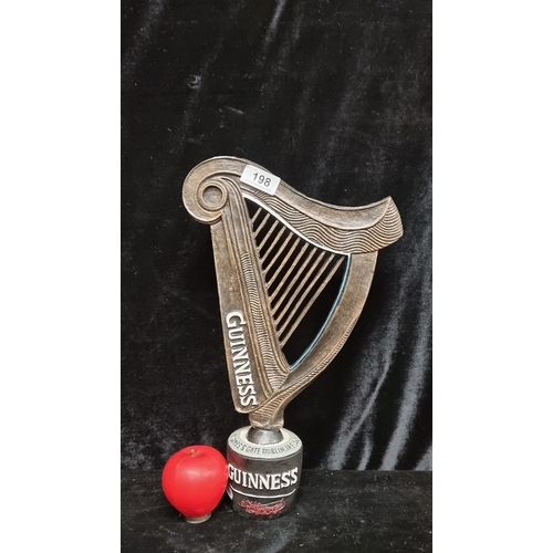 198 - A Guinness advertising piece in the form of the iconic harp.