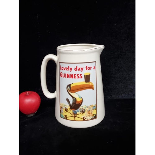 214 - A large 'Guinness' advertising pitcher jug. Features the iconic toucan.