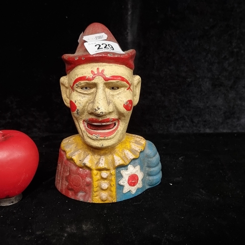 229 - A very heavy humorous cast metal Money box, in the form of a Clown. I dont eat clowns they taste fun... 