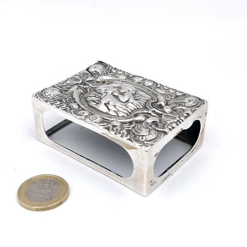 23 - A silver Vesta box holder hallmarked Birmingham with attractive repousse face. Dimensions: 7 x 5 cms... 