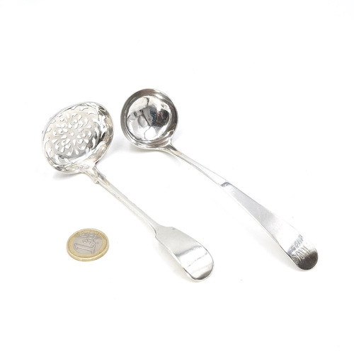 24 - Two sterling silver items - A Victorian sugar sifter hallmarked London. Together with a sauce ladle ... 