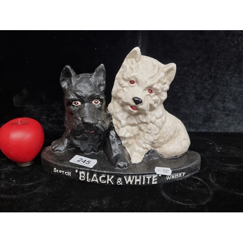 245 - A heavy metal 'Scotch Black and White Whiskey' advertising figure. Features charming black Scotties ... 