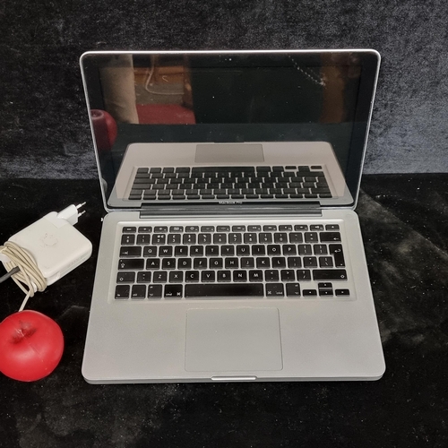 287 - An Apple Macbook Pro 2010 laptop with charger