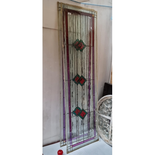 302 - Star Lot : A pair of very large full size stained glass panels featuring red and green diamond patte... 