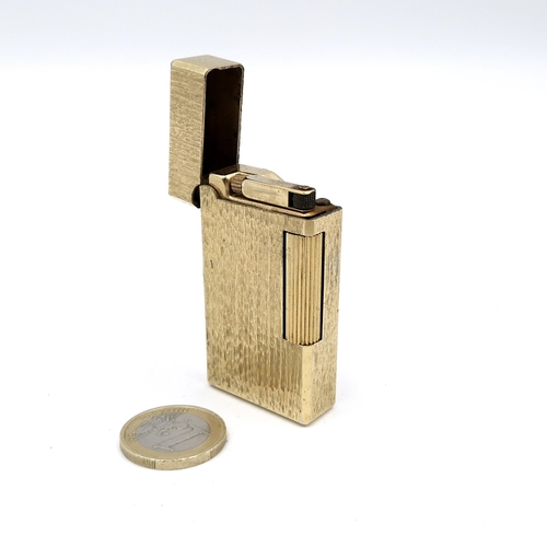 33 - A Flaminaire gold metal lighter. Dimensions: 6 x 3 cms. Weight - 82 grams. As per photographed. Info... 