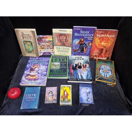 332 - A bag containing an interesting selection of books and tarot cards for those interested in witchcraf... 