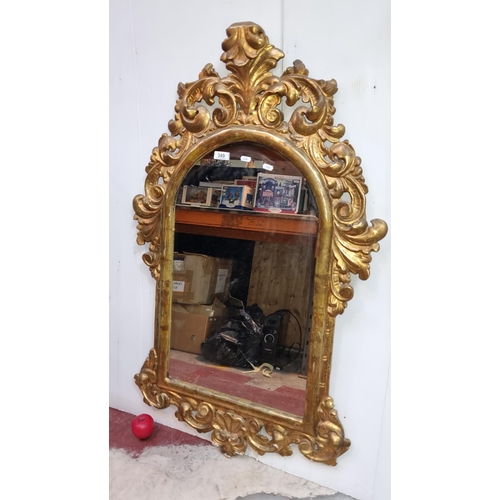 349 - Star Lot : A gorgeous French Louis XV gilt gold mirror featuring carved foliate and scrollwork desig... 