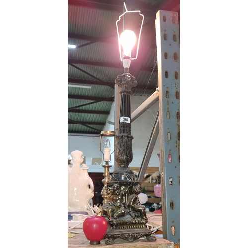 385 - Star Lot : A heavy large  antique French brass and marble table lamp. Features four cherubs to base.... 