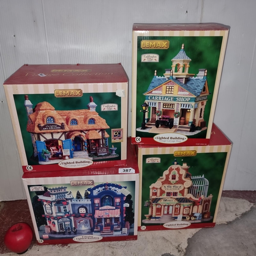 387 - Four vintage Lemax light up shops from the Village Collection. All in original boxes. Would make fab... 