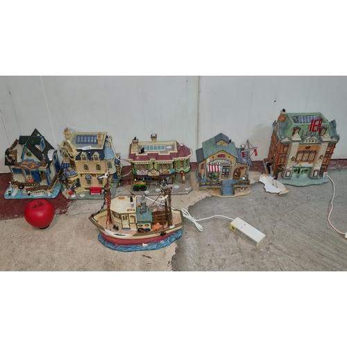 391 - Six vintage Lemax figures including a five village shops and a light up fishing boat.