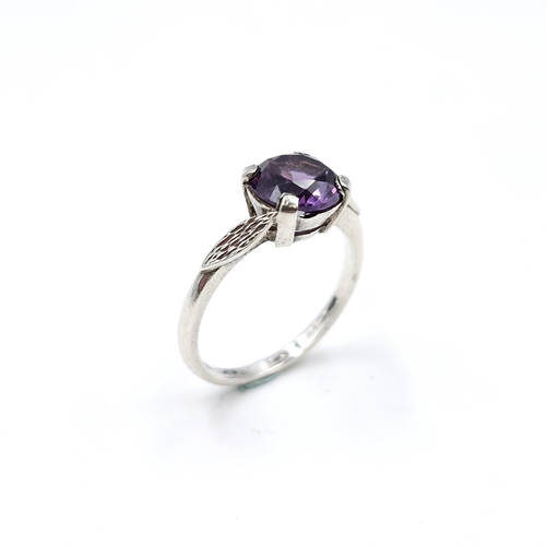 43 - A sterling silver single stone amethyst ring. Size - O. Weight - 2.62 grams.