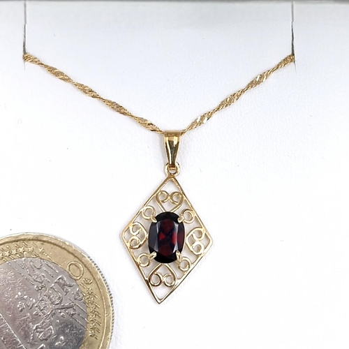 46 - A nine carat gold garnet stone pendant necklace. Length of chain - 42 cms. Weight - 1.66 grams.