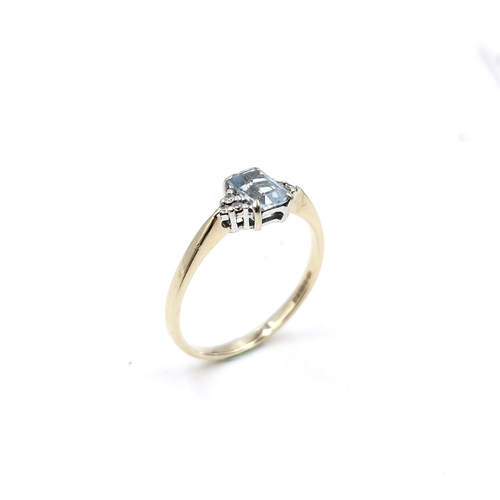 55 - Star Lot : A lovely nine carat gold aquamarine and diamond stone ring. Size - Q. Weight - 1.74 grams... 