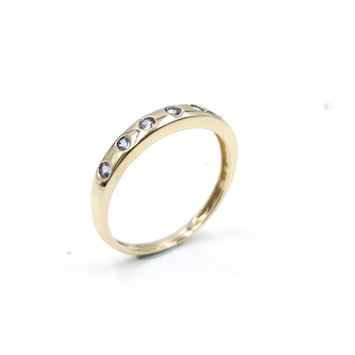 58 - A pretty nine carat gold Tanzanite half eternity ring. Size - R. Weight - 1.72 grams.