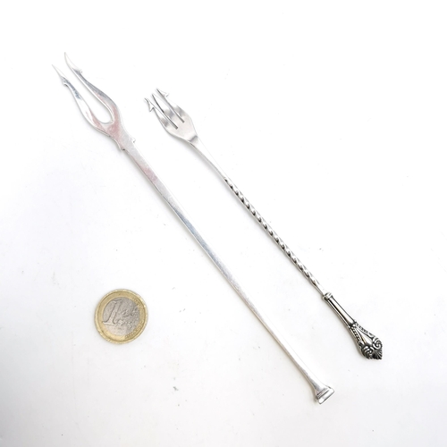 6 - Two sterling silver pickle forks. The first hallmarked Sheffield dated 1941. Length - 20 cms. Weight... 