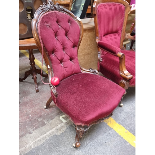 647 - An antique Victorian mahogany spoon back parlour chair. Lovely floral carved detailing and red velve... 