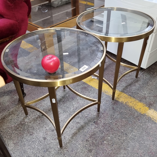 660 - A stylish pair of glass top polished brass occasional side tables. Lovely tables in good order. 51cm... 