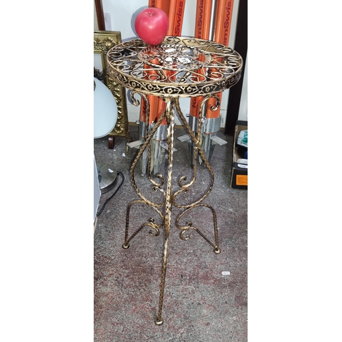 684 - A very pretty brass toned metal plant stand.