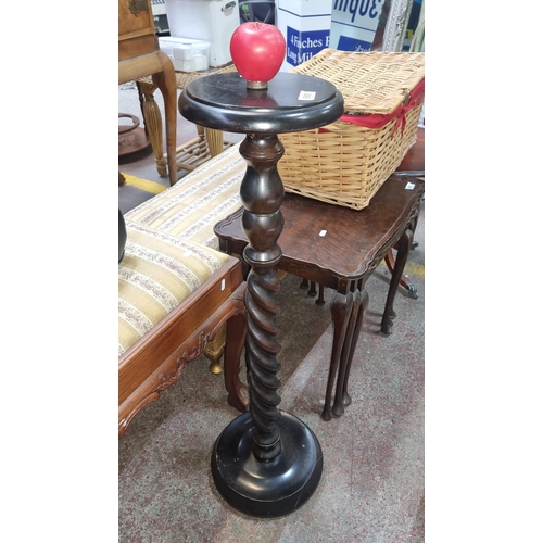 690 - A nice ebonized wood plant stand with a turned wood barley twist column.