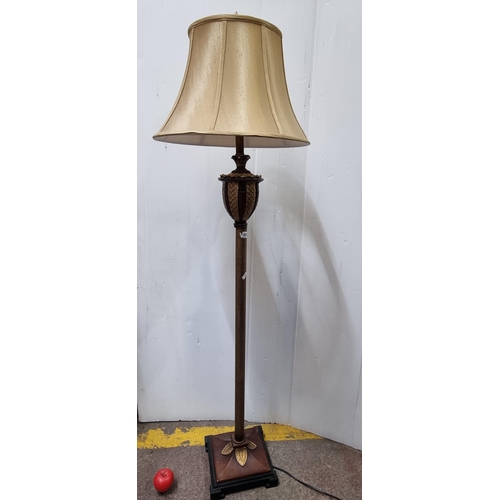 693 - A tall vintage floor lamp with column stand and champagne fabric shade.