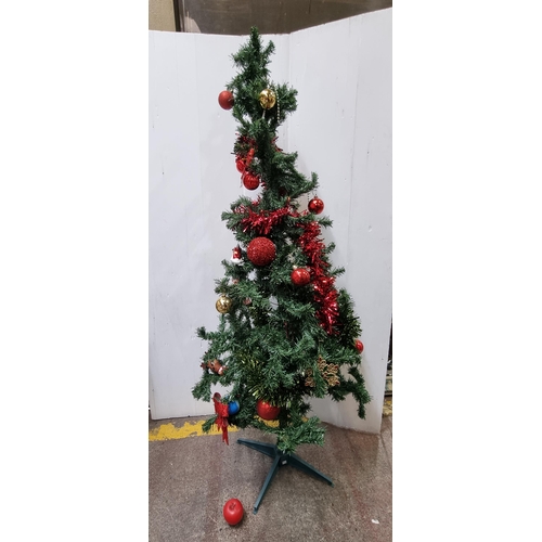 695 - A charming neatly sized Christmas tree decorated with red tinsel and baubles. Ideal for a studio, ap... 