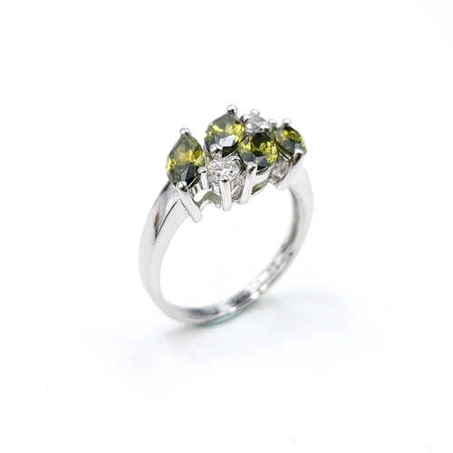 510 - A sterling silver peridot and gemstone ring. Size - R. Weight - 4.3 grams.