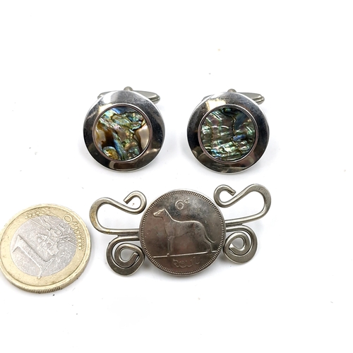 532 - An Irish 6d coin brooch - missing pin. Together with a pair of abalone shell cuff links. Boxed.