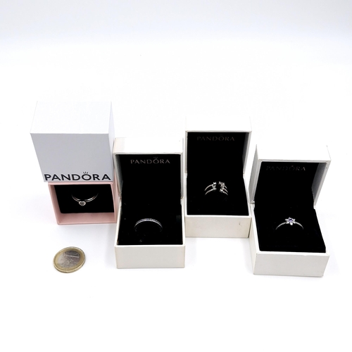 575 - A collection of four Pandora boxed gem set rings.