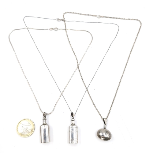 586 - Three sterling silver perfume bottles with necklace attachment. Total weight - 23.45 grams.