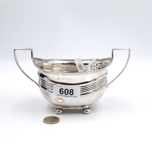 608 - A sterling silver sugar bowl with dart rim standing on four ball feet hallmarked Birmingham - 1904. ... 