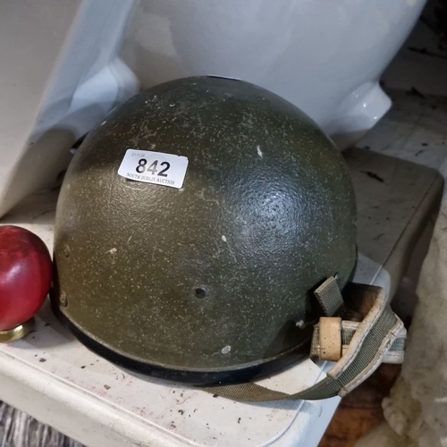 842 - A 1980s Irish Army Kevlar helmet with liner and chin strap.