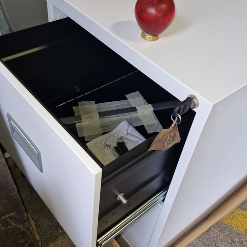 853 - A brand new White two-drawer metal filing cabinet with lock and key.