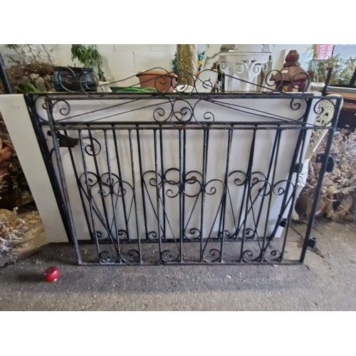 858 - Star Lot : Ornate wrought iron double gate featuring intricate scrollwork. . Approximately 111 cm in... 