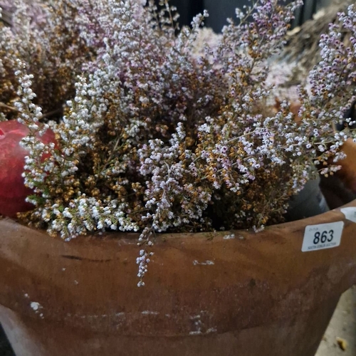 863 - Large terracotta pot filled with heather.