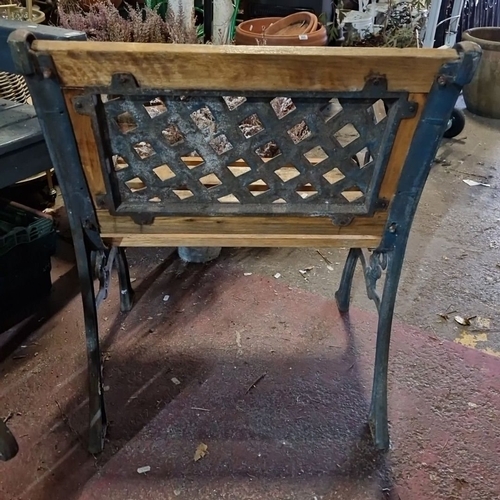 867 - Pair of vintage wooden garden benches with ornate cast iron armrests and lattice back design. heavy ... 