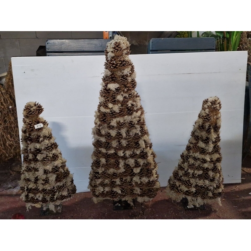 870 - Set of three pinecone and moss decorative trees, varying in height. Natural, rustic design.