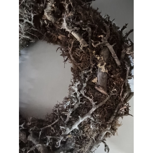 871 - Three rustic wreaths crafted with pinecones and natural moss, showcasing a textured design.